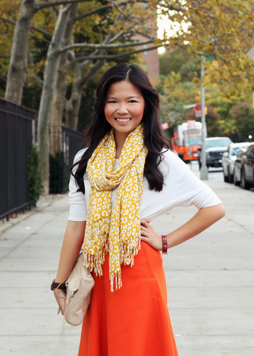 Jenny in Jacquard; NYC fashion blogger; style blog; fall outfit photos; Halloween inspired outfit; Topshop cream sweater top; Banana Republic yellow leopard scarf; H&M orange a-line skirt; H&M gold captoe brown flats; Michael Kors tortoise boyfriend watch; Rebecca Minkoff nude beige MAC clutch