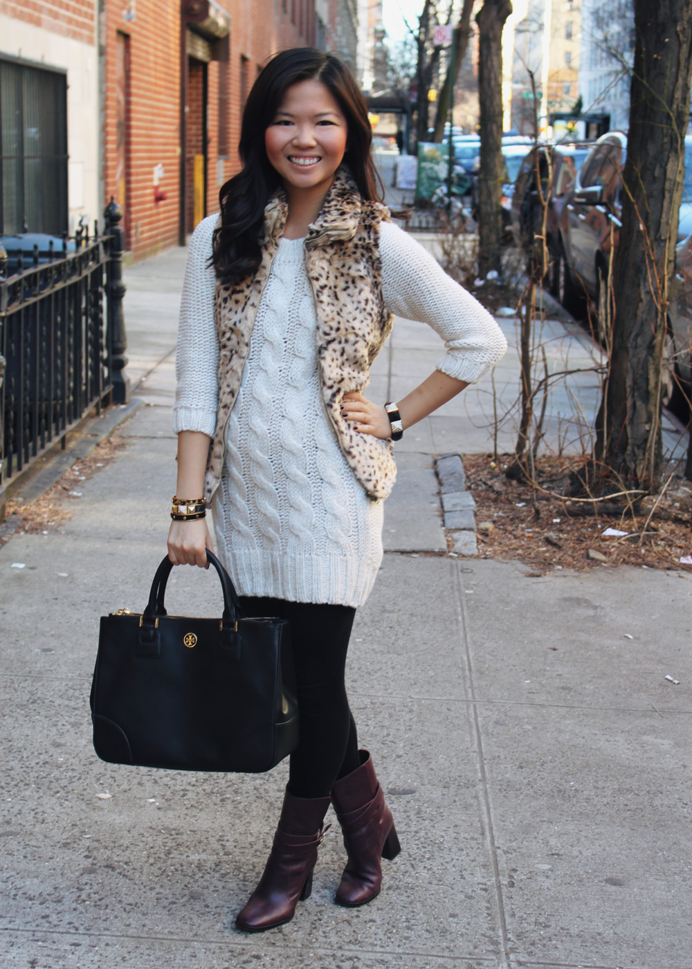 Jenny in Jacquard; NYC fashion blogger; style blog; outfit photo; winter cold weather outfit; Zara Kids Girls XL cheetah faux fur vest; Zara cable knit sweater dress; Forever 21 black leggings; C.Wonder skinny calf hair bangles; Juicy Couture pave pyramid bracelet; Tory Burch black Robinson tote bag; Diane von Furstenberg DVF Yardley maroon oxblood heel