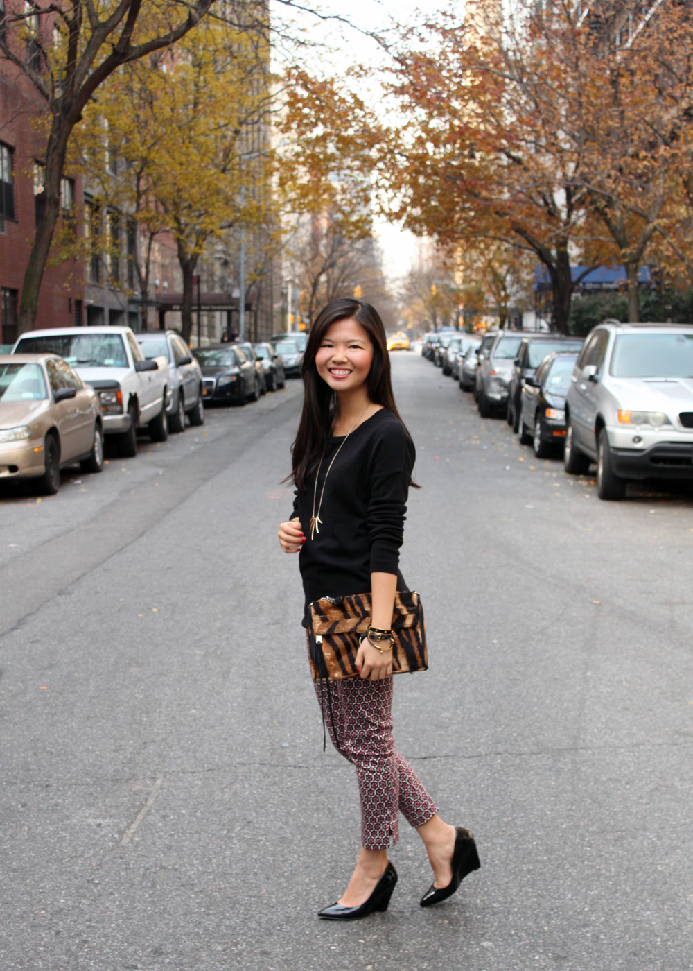 Jenny in Jacquard; NYC fashion blogger; style blog; Old Navy black sweater; H&M printed pants; Sequin talon necklace; Rebecca Minkoff tiger print MAC clutch; Pour la Victoire Mai wedge in black patent; Michael Kors tortoise gold boyfriend watch; Juicy Couture pave pyramid bracelet; C.Wonder skinny calf hair bangle; KTownesend black and gold skinny bangles