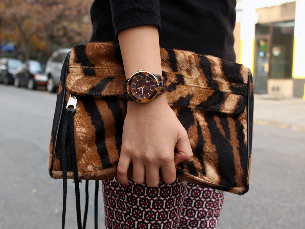 Jenny in Jacquard; NYC fashion blogger; style blog; Old Navy black sweater; H&M printed pants; Sequin talon necklace; Rebecca Minkoff tiger print MAC clutch; Pour la Victoire Mai wedge in black patent; Michael Kors tortoise gold boyfriend watch; Juicy Couture pave pyramid bracelet; C.Wonder skinny calf hair bangle; KTownesend black and gold skinny bangles