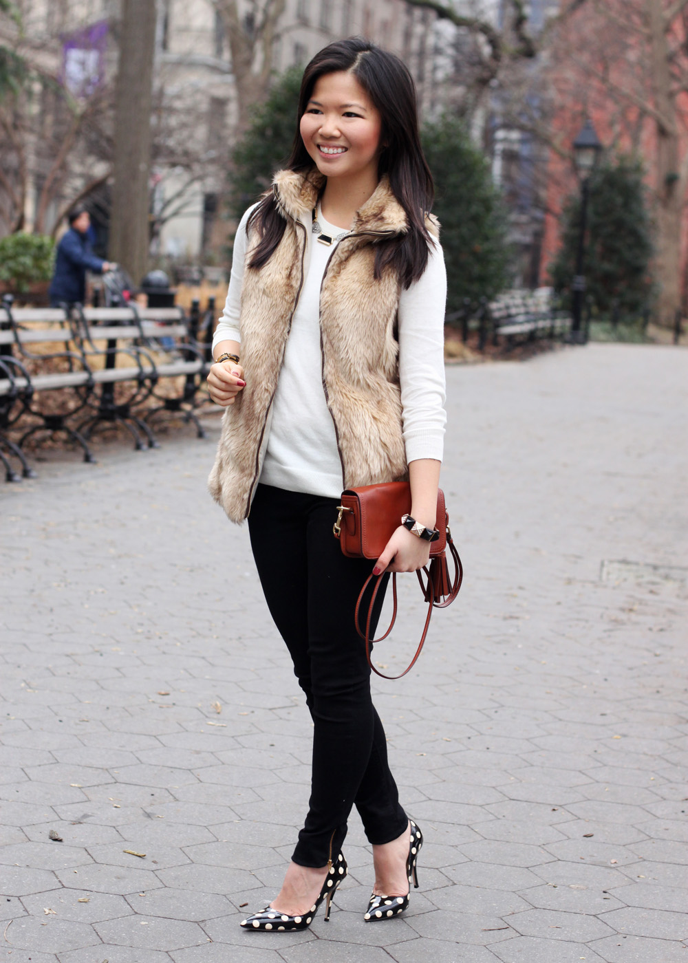 Jenny in Jacquard; NYC fashion blogger; style blog; outfit photo; Zara Kids girl's faux fur vest; C. Wonder creme crew neck sweater; Zara black skinny legging jeans with zip; Sequin necklace; C. Wonder calf hair skinny bangle; Juicy Couture stretch pyramid pave bracelet; Coach Legacy Penny cross body bag in cognac; Kate Spade New York Licorice polka dot pumps