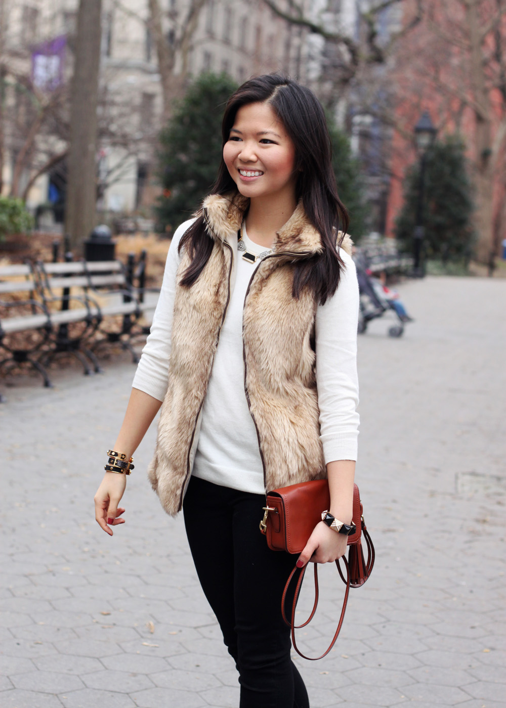 Jenny in Jacquard; NYC fashion blogger; style blog; outfit photo; Zara Kids girl's faux fur vest; C. Wonder creme crew neck sweater; Zara black skinny legging jeans with zip; Sequin necklace; C. Wonder calf hair skinny bangle; Juicy Couture stretch pyramid pave bracelet; Coach Legacy Penny cross body bag in cognac; Kate Spade New York Licorice polka dot pumps