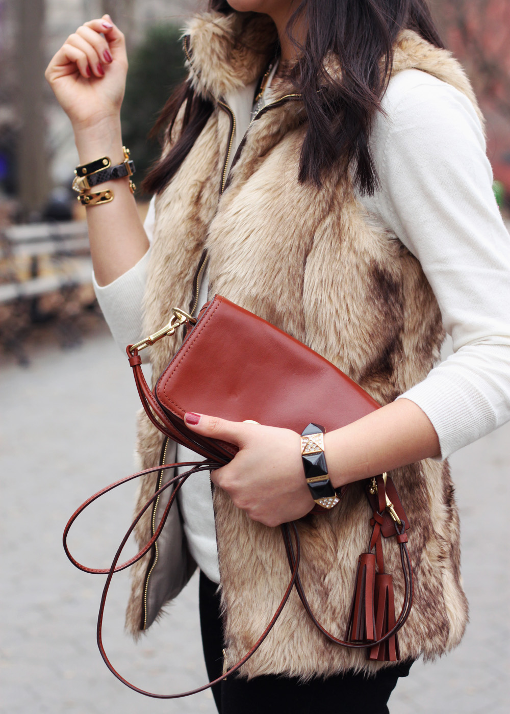 Jenny in Jacquard; NYC fashion blogger; style blog; outfit photo; Zara Kids girl's faux fur vest; C. Wonder creme crew neck sweater; Zara black skinny legging jeans with zip; Sequin necklace; C. Wonder calf hair skinny bangle; Juicy Couture stretch pyramid pave bracelet; Coach Legacy Penny cross body bag in cognac; Kate Spade New York Licorice polka dot pumps