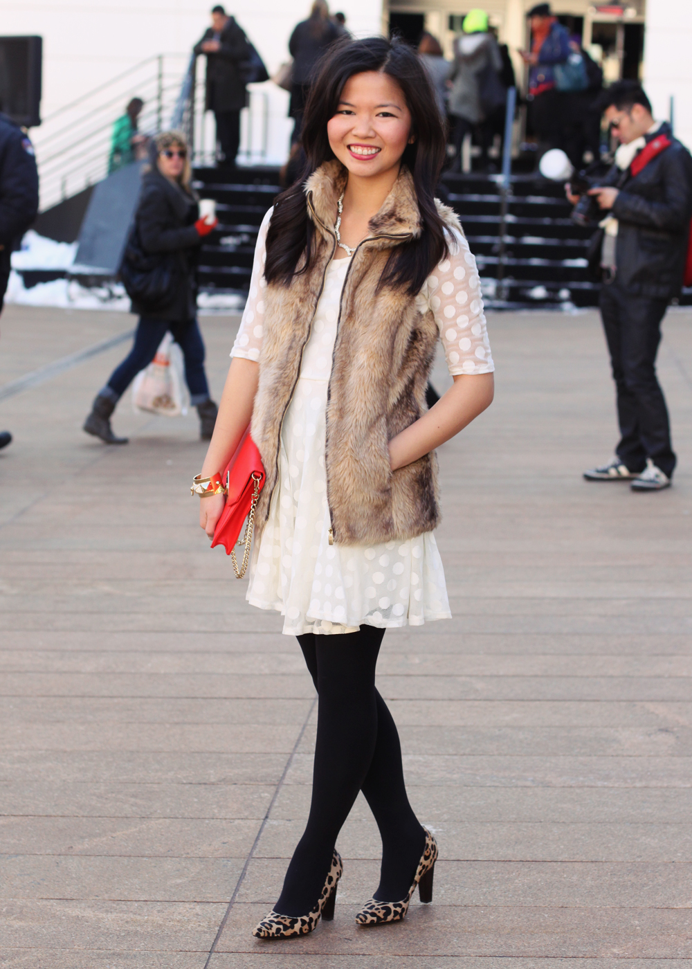 Skirt the Blog; NYC fashion blogger; style blog; Valentine's Day outfit photo; Lulu's white polka dot dress; Zara Girl faux fur vest; Sequin pave branch necklace; C. Wonder red saffiano gold tab-lock clutch; H&M black tights; DVF April leopard heels; Juicy Couture gold cufe
