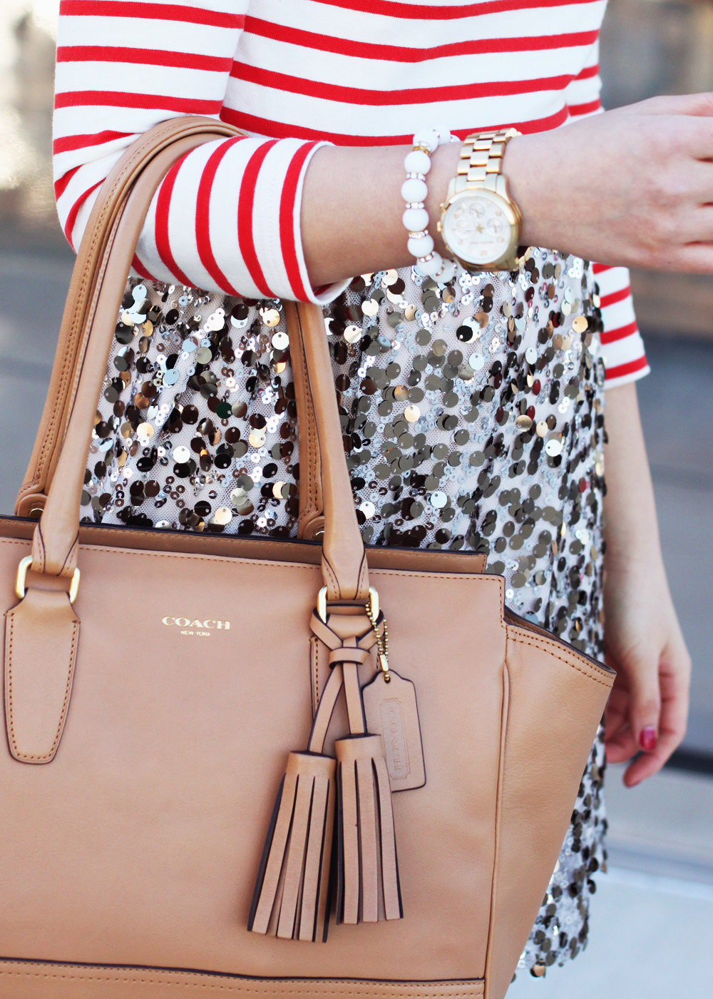 Skirt The Rules; NYC fashion blogger; style blog; spring outfit photos; sequin and stripes; StyleMint Broadway striped t-shirt; Joe Fresh gold sequin skirt; Banana Republic sparkle stone statement necklace; Michael Kors gold mother of pearl boyfriend watch; A Beautiful Heart bubblegum white stretch bracelet; Coach Candace carryall tote in camel; Diane von Furstenberg DVF April leopard heels