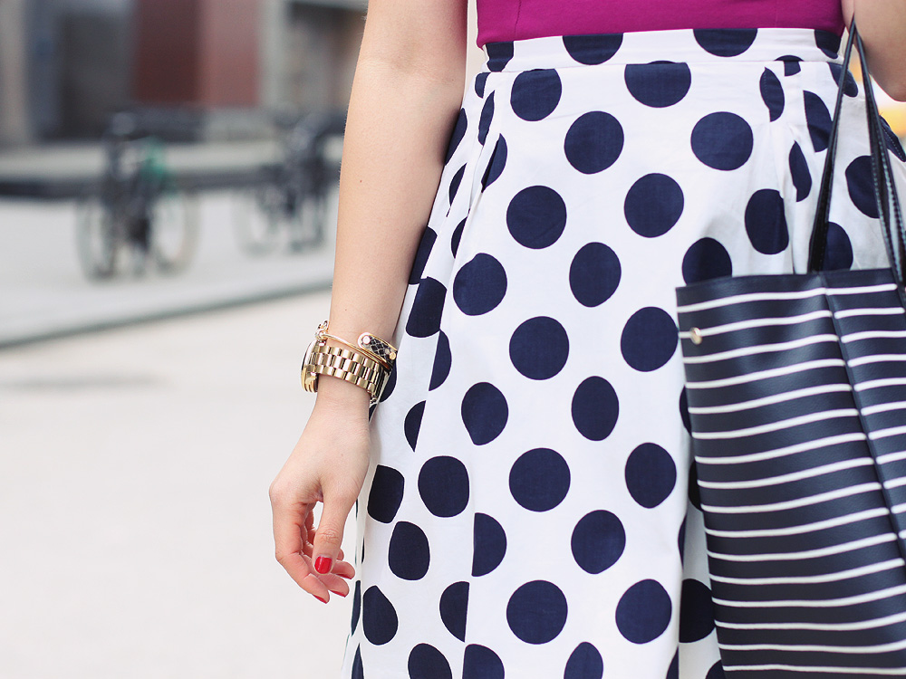 Skirt The Rules Blog; NYC fashion blogger; style blog; spring outfit photos; Topshop fuschia peplum top; J.Crew Factory Crew Cuts polka dot skirt; JewelMint jeweled collar necklace; Michael Kors gold mother of pearl boyfriend watch; BaubleBar arrow bangle; C. Wonder snakeskin skinny bracelet; J.Crew turquoise stretch bracelet; Kate Spade City Stripe Sidney tote bag; Pour La Victoire Mai patent leather wedge pump