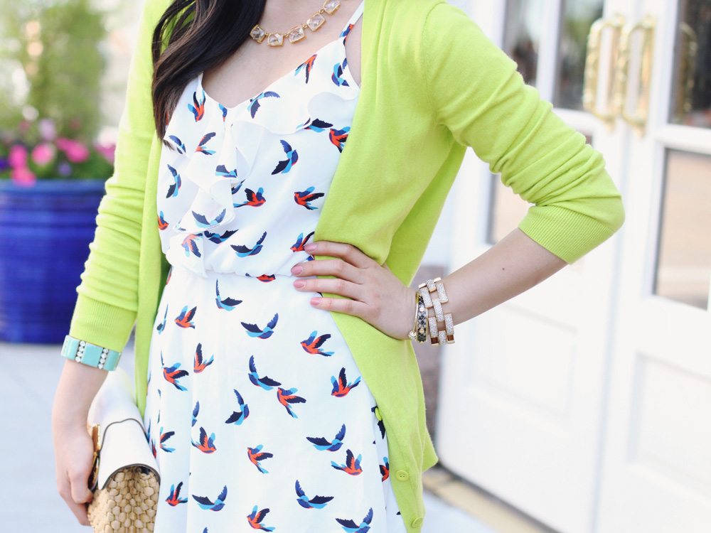 Skirt The Rules Blog; NYC fashion blogger; style blog; spring outfit photo; Gap Luxlight V Neck Neon Cardigan; Bird Print Dress; Michael Kors leather straw clutch; C. Wonder crystal necklace; J.Crew turquoise stretch bracelet; J.Crew pave square link bracelet; C. Wonder snakeskin skinny cuff; BaubleBar arrow cuff; Madewell Broadway brown leather sandals