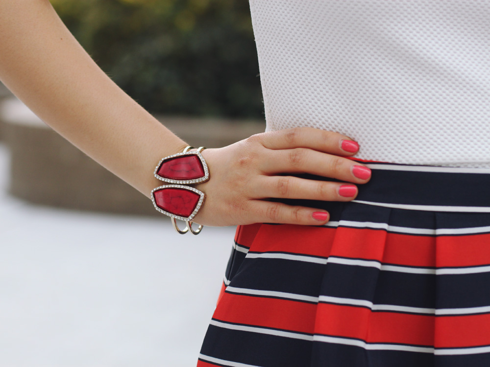 Skirt The Rules Blog; NYC fashion blogger; style blog; spring outfit photos; H&M cream structured shoulder top; J.Crew Factory red and navy striped skirt; Juicy Couture statement necklace; gemstone cuff bracelet; Kate Spade City Sidney Striped tote bag; Pour La Victoire Mai wedge; J.Crew pave square link bracelet