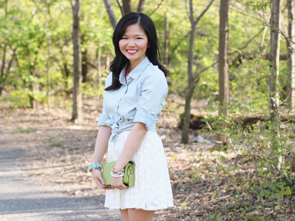 Skirt The Rules Blog; NYC fashion blogger; style blog; spring outfit photo; J.Crew Factory chambray shirt; Lulu's white polka dot dress; BaubleBar pink tab necklace; Coach Penny crossbody bag in lime green; J.Crew pave square link bracelet; J.Crew turquoise stretch bracelet; C. Wonder snakeskin bangle; Essie Play Date purple nail polish; Rosegold nude cut out heels