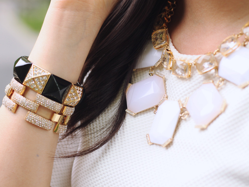 Skirt The Rules Blog; NYC fashion blogger; style blog; spring outfit photo; H&M cream structured shoulder top; Modcloth geometric printed skirt; Tory Burch Robinson satchel tote; Banana Republic sparkle stone statement necklace; C. Wonder crystal gold necklace; C. Wonder snake skinny cuff; Juicy Couture pave pyramid stretch bracelet; J.Crew pave square link bracelet