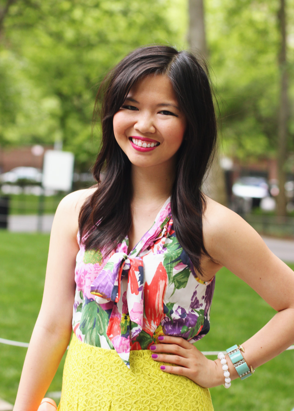 Skirt The Rules Blog; NYC fashion blogger; style blog; spring outfit photo; J.Crew floral print pussybow blouse; Anthropologie neon chartreuse lace skirt; J.Crew Factory neon rose clutch; J.Crew turquoise stretch bracelet; A Beautiful Heart white bubblegum bracelet; BaubleBar arrow cuff; Michael Kors gold boyfriend watch; Sam Edelman colorblock wedge; Essie DJ Play That Song neon purple nail polish