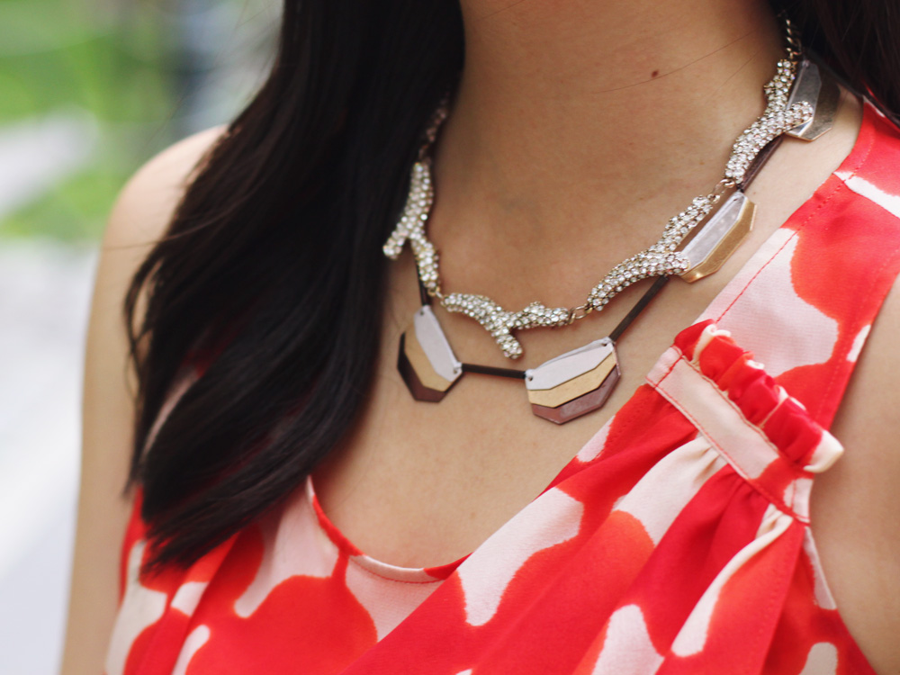 Skirt The Rules Blog; NYC fashion blogger; style blog; spring outfit photos; Fashion 4 Ways; Anthropologie orange print blouse; J.Crew Factory neon rose No. 2 Pencil Skirt; BaubleBar bronze geometric necklace; Sequin pave branch necklace; Michael Kors white leather straw clutch; J.Crew pave square link bracelet; Sam Edelman Sophie wedge