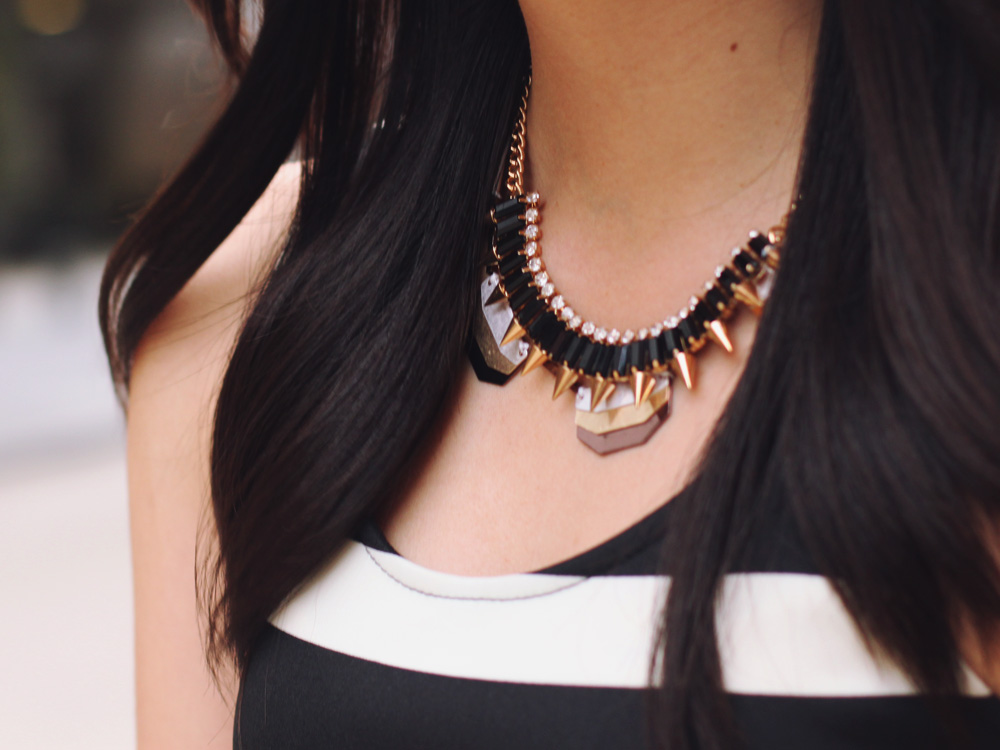 Skirt The Rules Blog; NYC fashion blogger; style blog; spring outfit photo; black and white striped dress; J.Crew Factory Vero neon yellow clutch; ShoeMint hot pink pointed pumps; Juicy Couture pave pyramid stretch bracelet; C. Wonder skinny bangles; Crown and Glitter black and gold spike necklace; BaubleBar bronze geometric necklace