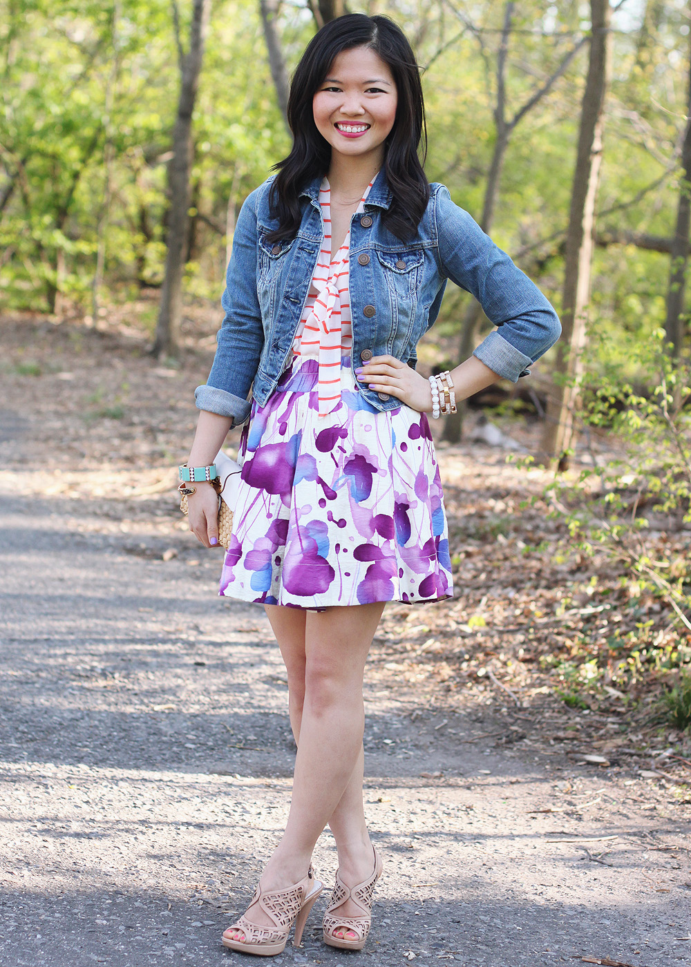 Skirt The Rules Blog; NYC fashion blogger; style blog; spring outfit photo; Banana Republic Factory striped pussybow blouse; Forever 21 floral water color skirt; American Eagle denim jacket; Michael Kors straw clutch; J.Crew turquoise stretch bracelet; A Beautiful Heart bubblegum bracelet; J.Crew pave square link bracelet; Sam Edelman colorblock wedge