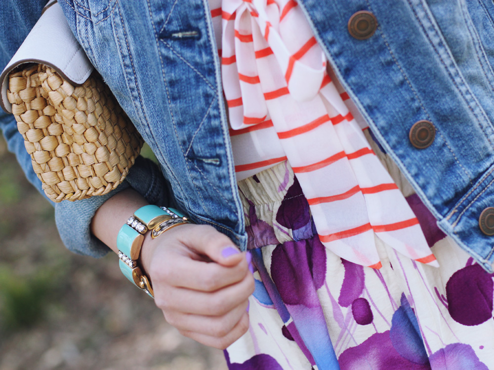 Skirt The Rules Blog; NYC fashion blogger; style blog; spring outfit photo; Banana Republic Factory striped pussybow blouse; Forever 21 floral water color skirt; American Eagle denim jacket; Michael Kors straw clutch; J.Crew turquoise stretch bracelet; A Beautiful Heart bubblegum bracelet; J.Crew pave square link bracelet; Sam Edelman colorblock wedge