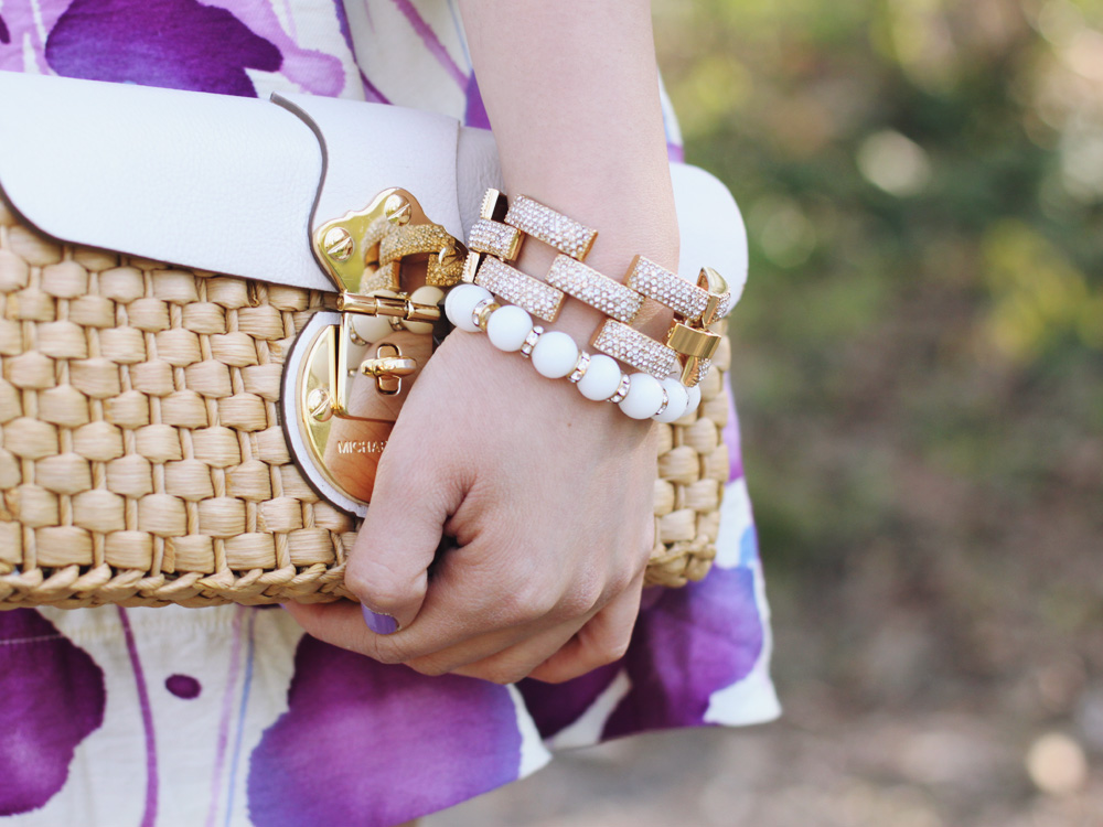 Skirt The Rules Blog; NYC fashion blogger; style blog; spring outfit photo; Banana Republic Factory striped pussybow blouse; Forever 21 floral water color skirt; American Eagle denim jacket; Michael Kors straw clutch; J.Crew turquoise stretch bracelet; A Beautiful Heart bubblegum bracelet; J.Crew pave square link bracelet; Sam Edelman colorblock wedge