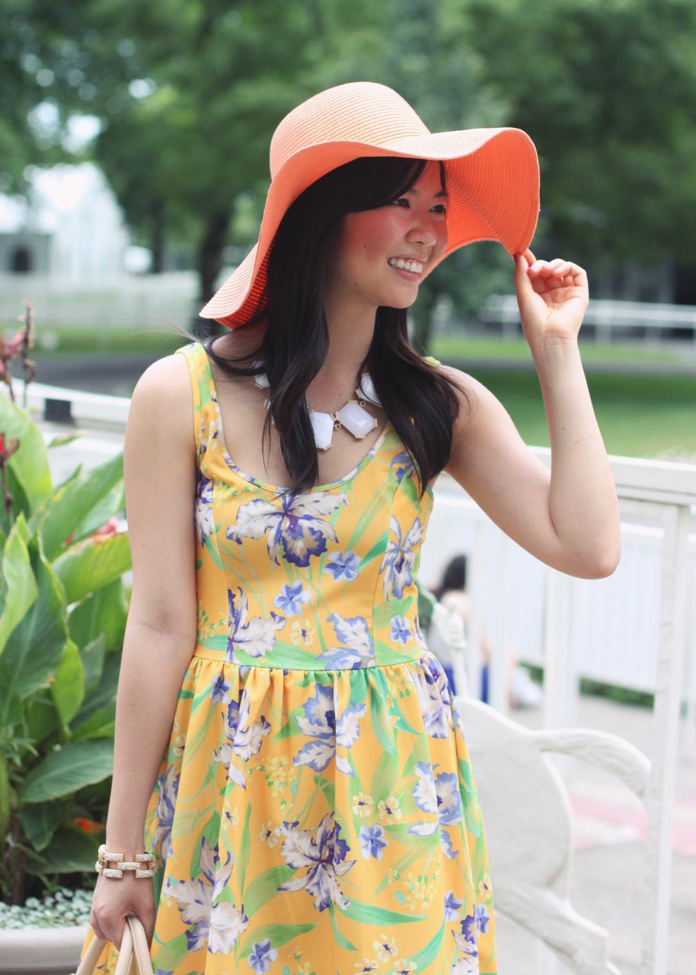 Skirt The Rules Blog; NYC fashion blogger; style blog; summer outfit photo; what to wear to a derby or horse race; Zara TRF neon yellow floral print dress; Joe Fresh orange floppy hat; Banana Republic sparkle stone white statement necklace; Tory Burch straw satchel handbag; J.Crew pave square link bracelet; Sam Edelman Sophie colorblock wedge; Essie DJ Play That Song neon purple nail polish