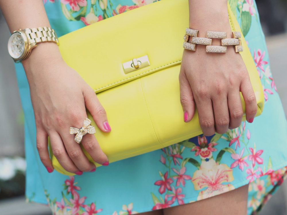 Skirt The Rules Blog; NYC fashion blogger; style blog; summer outfit photo; Hello Glam Garden Party floral dress; Courtney Kerr x BaubleBar Cerise Arrowhead Collar Necklace; J.Crew Factory Vero Neon Yellow Clutch; J.Crew pave square link bracelet; Brighthouse Bauble gold bow ring; Sam Edelman Sophie coral cream colorblock wedge; Michael Kors gold BF watch
