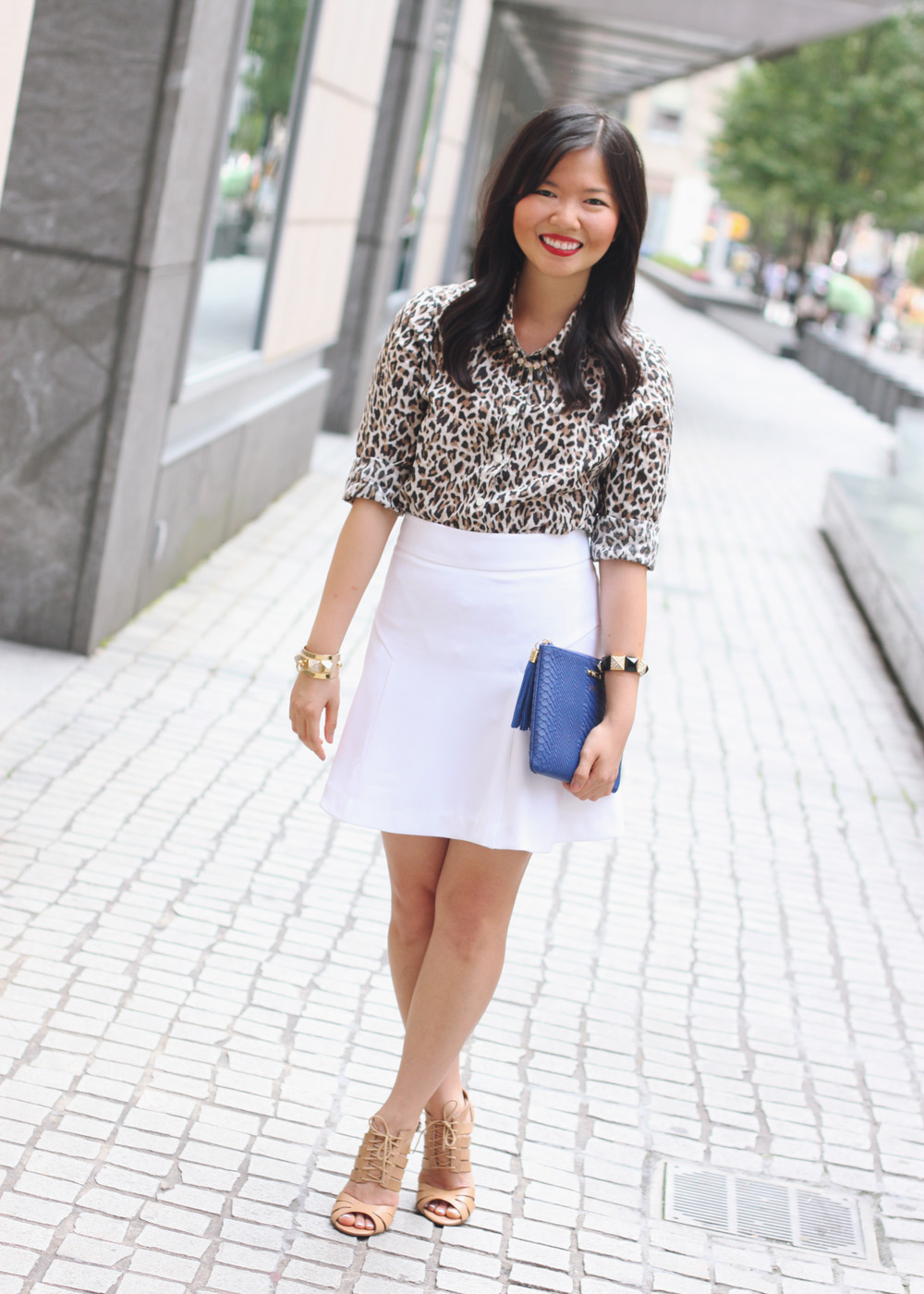 Skirt The Rules Blog; NYC fashion blogger; style blog; summer outfit photo; J.Crew leopard print button up shirt; Express white a-line skirt; T&J Designs black luxe crystal necklace; Express high waist fit and flare white skirt; Gigi New York All In One python embossed clutch; Juicy Couture pave pyramid gold cuff; Juicy Couture pave pyramid black stretch bracelet; ShoeMint Elizabeth lace up cut out heels