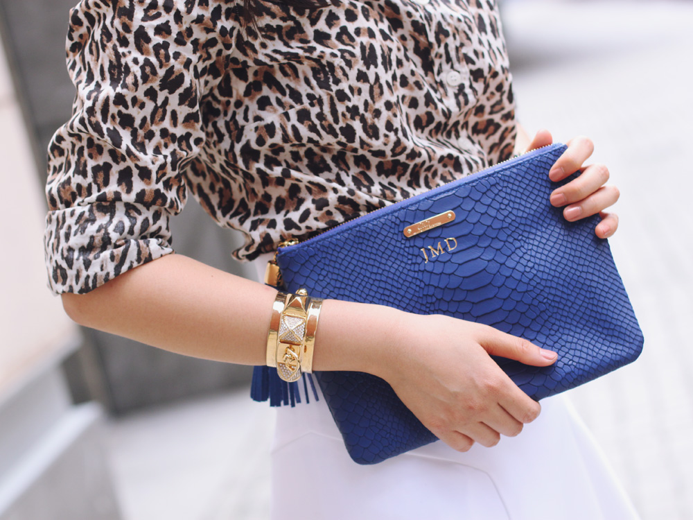 Skirt The Rules Blog; NYC fashion blogger; style blog; summer outfit photo; J.Crew leopard print button up shirt; Express white a-line skirt; T&J Designs black luxe crystal necklace; Express high waist fit and flare white skirt; Gigi New York All In One python embossed clutch; Juicy Couture pave pyramid gold cuff; Juicy Couture pave pyramid black stretch bracelet; ShoeMint Elizabeth lace up cut out heels