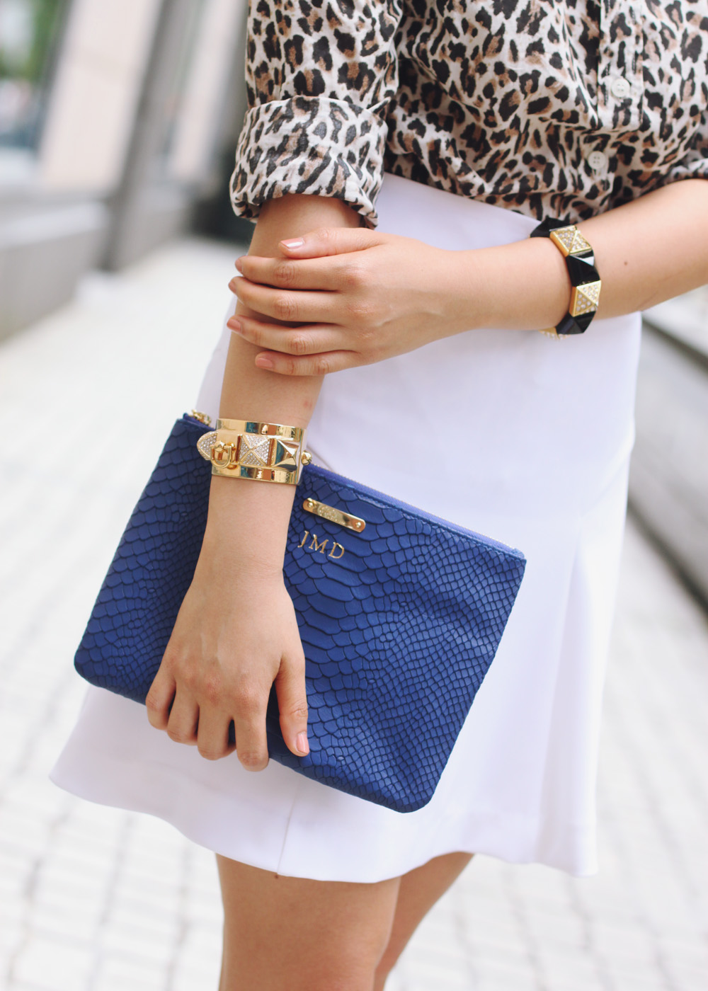 Skirt The Rules Blog; NYC fashion blogger; style blog; summer outfit photo; J.Crew leopard print button up shirt; Express white a-line skirt; T&J Designs black luxe crystal necklace; Express high waist fit and flare white skirt; Gigi New York All In One python embossed clutch; Juicy Couture pave pyramid gold cuff; Juicy Couture pave pyramid black stretch bracelet; ShoeMint Elizabeth lace up cut out heels