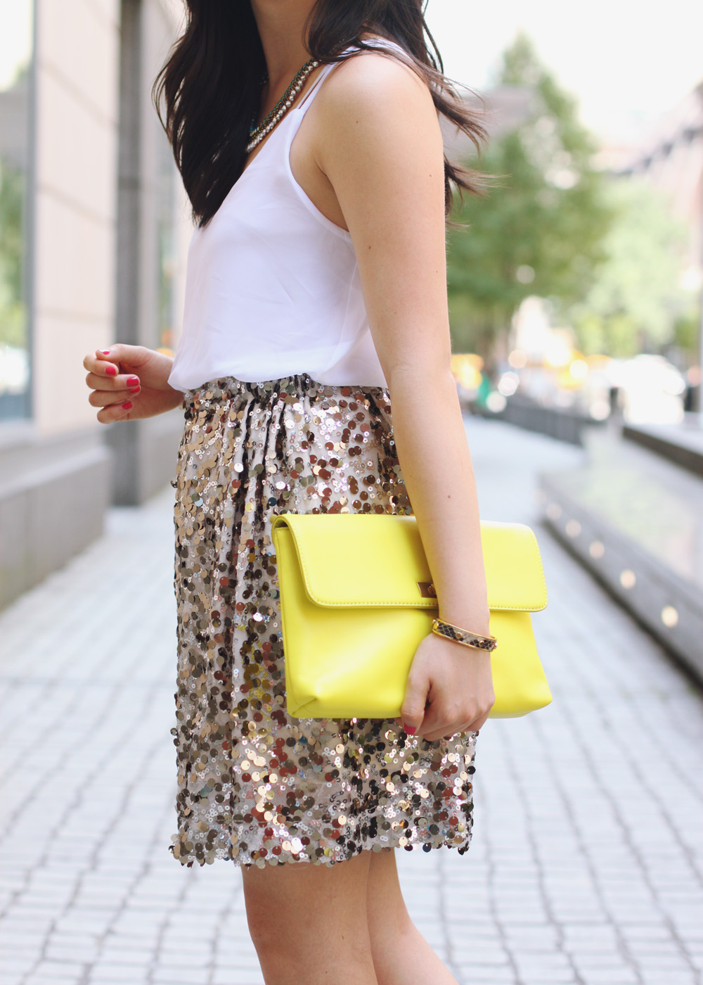 Skirt The Rules Blog; NYC fashion blogger; style blog; summer outfit photo; Tobi Square One white chiffon tank dress; Joe Fresh gold sequin a-line skirt; T&J Designs teardrop highlighter necklace; J.Crew Factory Vero neon yellow clutch; red gemstone bracelet; C. Wonder snakeskin skinny cuff; Zara snakeskin and neon heels with buckles