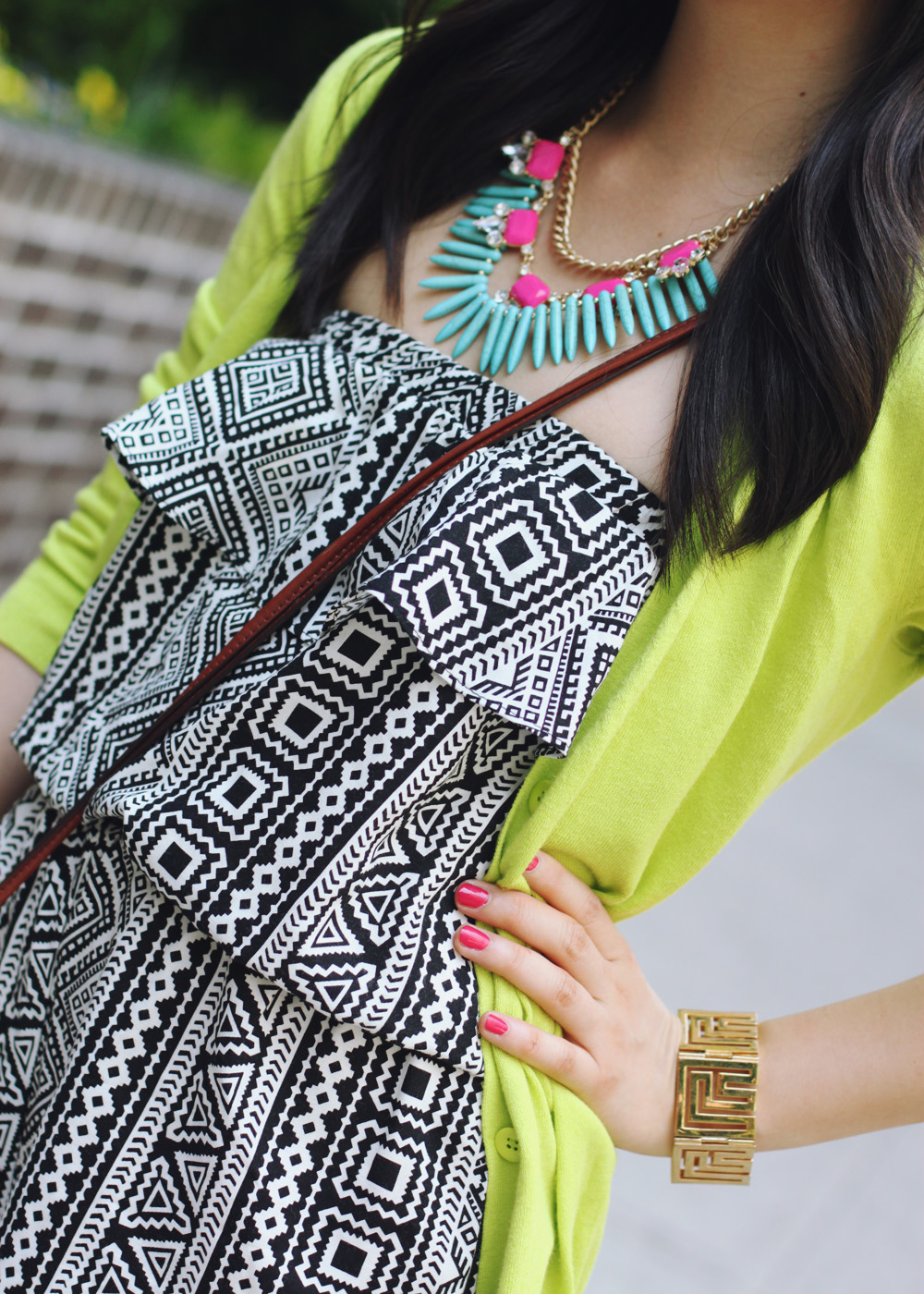 Skirt The Rules Blog; NYC fashion blogger; style blog; summer outfit photo; black and white tribal romper; Gap Luxe Light neon green cardigan; Courtney Kerr x Bauble Bar Neon Alaqua tribal statement necklace; CC Skye geometric gold bracelet; Coach Legacy Penny brown crossbody bag; C. Wonder leopard calf hair skinny bangle; Sam Edelman Sophie black and brown colorblock wedges