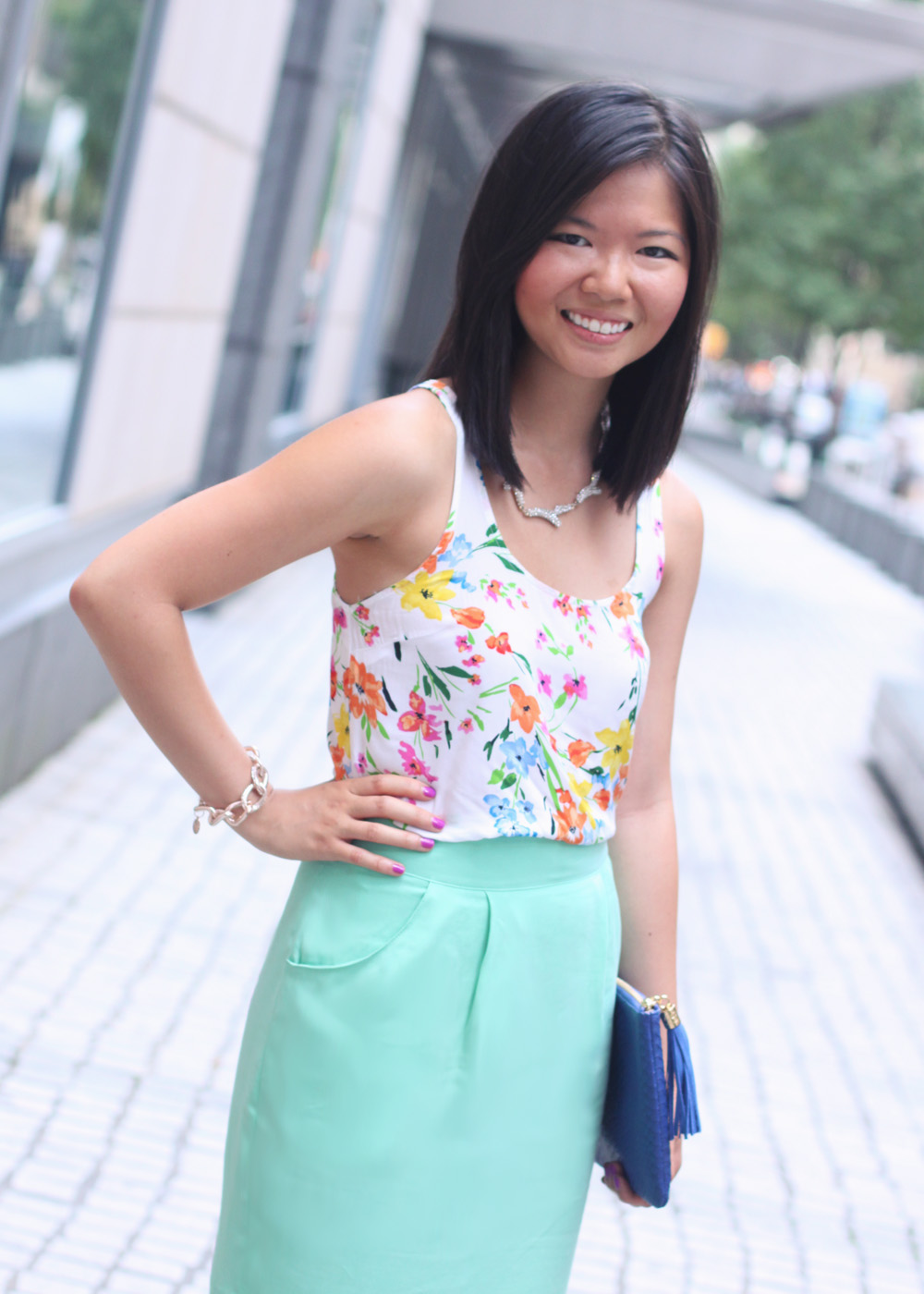 Skirt The Rules Blog; NYC fashion blogger; style blog; summer floral outfit photos; Old Navy floral tank top; Adam mint silk crepe skirt; Sequin pave branch necklace; Derng rosegold pave link bracelet; Gigi New York snake embossed All In One cobalt blue clutch; Essie's DJ Play That Song neon purple nail polish; ShoeMint Elizabeth nude lace up heels