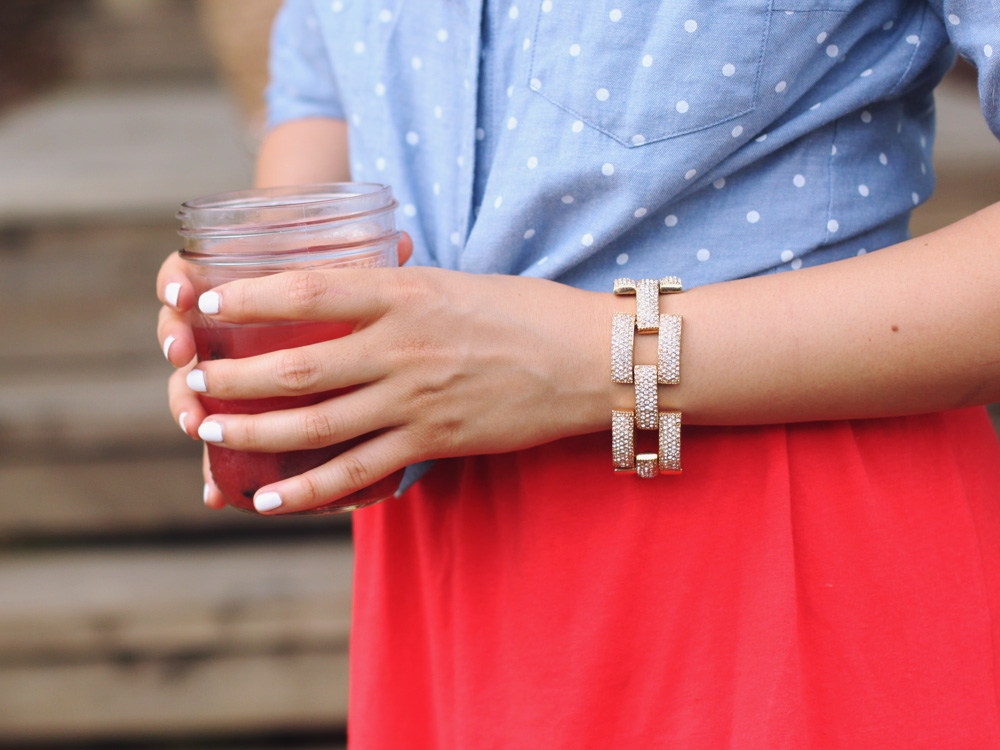 Skirt The Rules Blog; NYC fashion blogger; style blog; 4th of July outfit photo; J.Crew polka dot chambray top; Forever 21 red strapless dress; Banana Republic sparkle stone white statement necklace; J.Crew square pave link bracelet; H&M mirrored aviator sunglasses; Juicy Couture French Basket straw and sequin summer tote bag; Zara basic colorblock heel