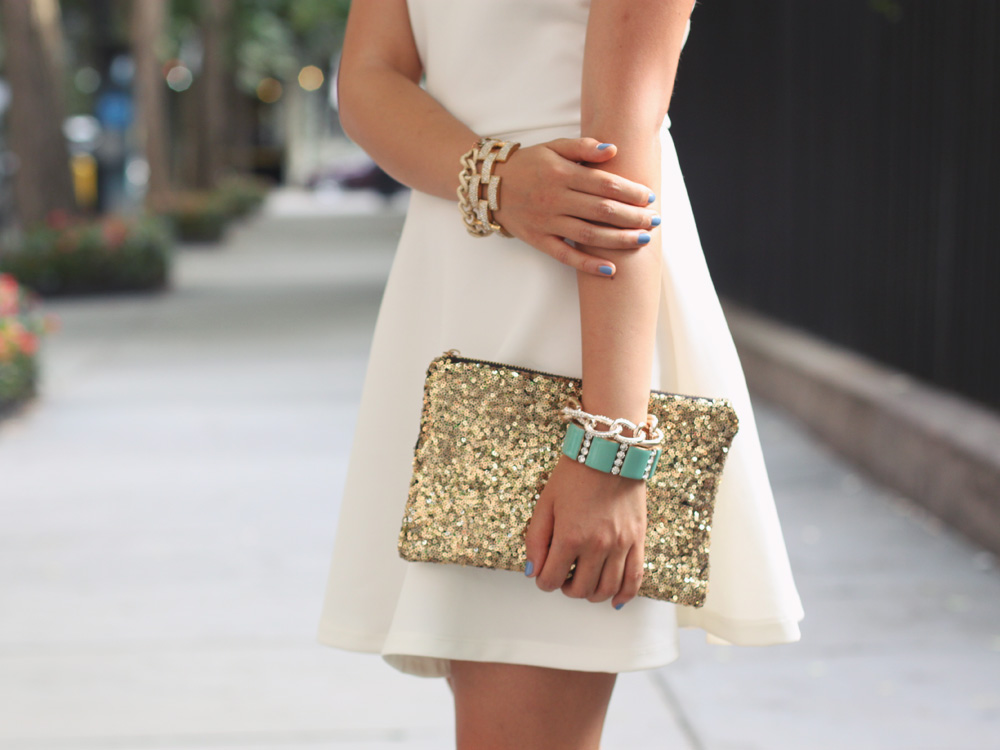 Skirt The Rules Blog; NYC fashion blogger; style blog; summer outfit photos; Lulu*s Go With The Bow Little White Dress; Hello Fab Gold Glam Sequin Clutch; J.Crew Pave Square Link Bracelet; Derng Rose Gold Chain Bracelet; Brighthouse Baubles Chain Bracelet; Zara Neon Snakeskin Heels