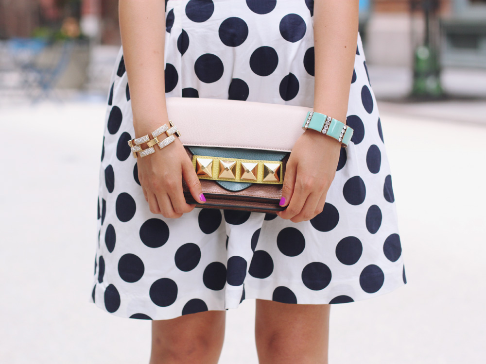 Skirt The Rules Blog; NYC fashion blogger; style blog; summer outfit photos; H&M chambray sleeveless button up top; J.Crew Kids Crew Cuts polka dot skirt; C. Wonder crystal necklace; Linea Pelle Grayson Bar Clutch; J.Crew turquoise stretch bracelet; J.Crew square pave link bracelet; Zara white beige colorblock heels