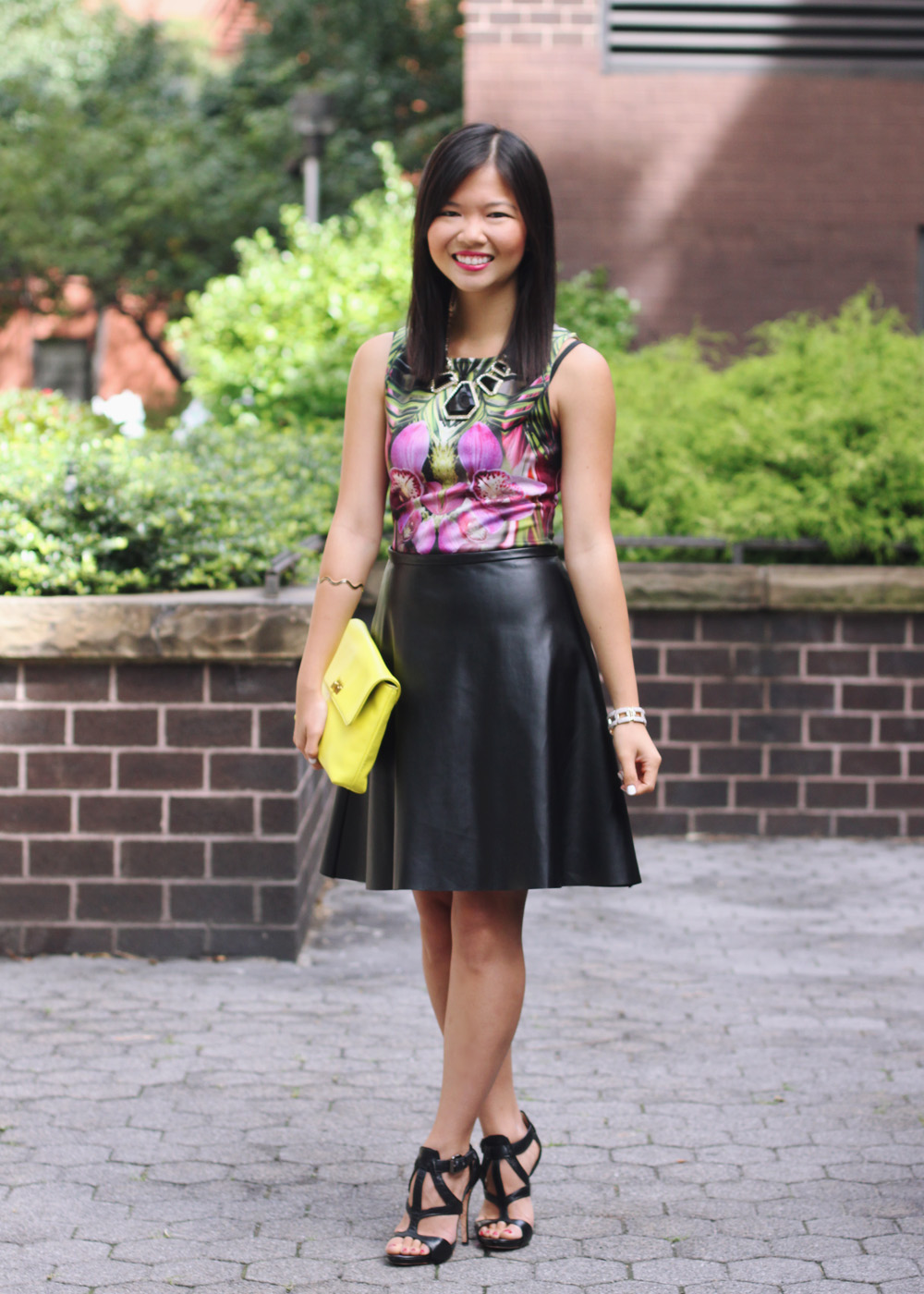 Skirt The Rules Blog; NYC fashion blogger; style blog; fall outfit photo;  Le Tote mirrored floral dress worn as top; Kirna Zabete x Target leather a-line skirt; BaubleBar black geometric statement necklace; J.Crew Factory Vero neon yellow clutch; L.A.M.B. black cut out heels