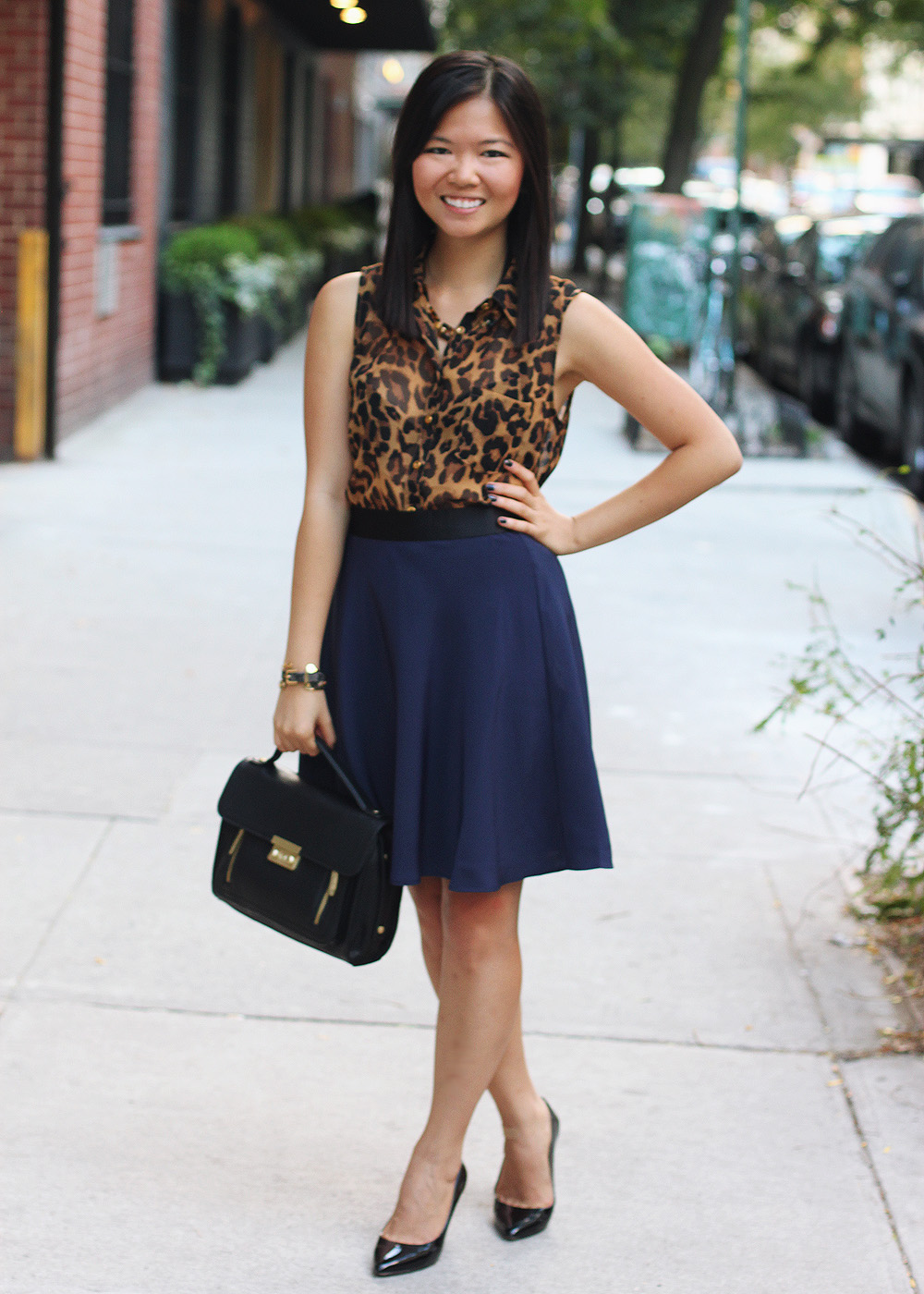 Skirt The Rules Blog; NYC fashion blogger; style blog; fall outfit photo; leopard sleeveless blouse; 3.1 Phillip Lim x Target navy skirt; 3.1 Phillip Lim black satchel; C. Wonder tortoise link necklace; C. Wonder snakeskin skinny bangle; Gorjana & Griffin alphabet disc bracelet; Juicy Couture pave pyramid bracelet; Pour La Victoire Mai patent black wedge pumps