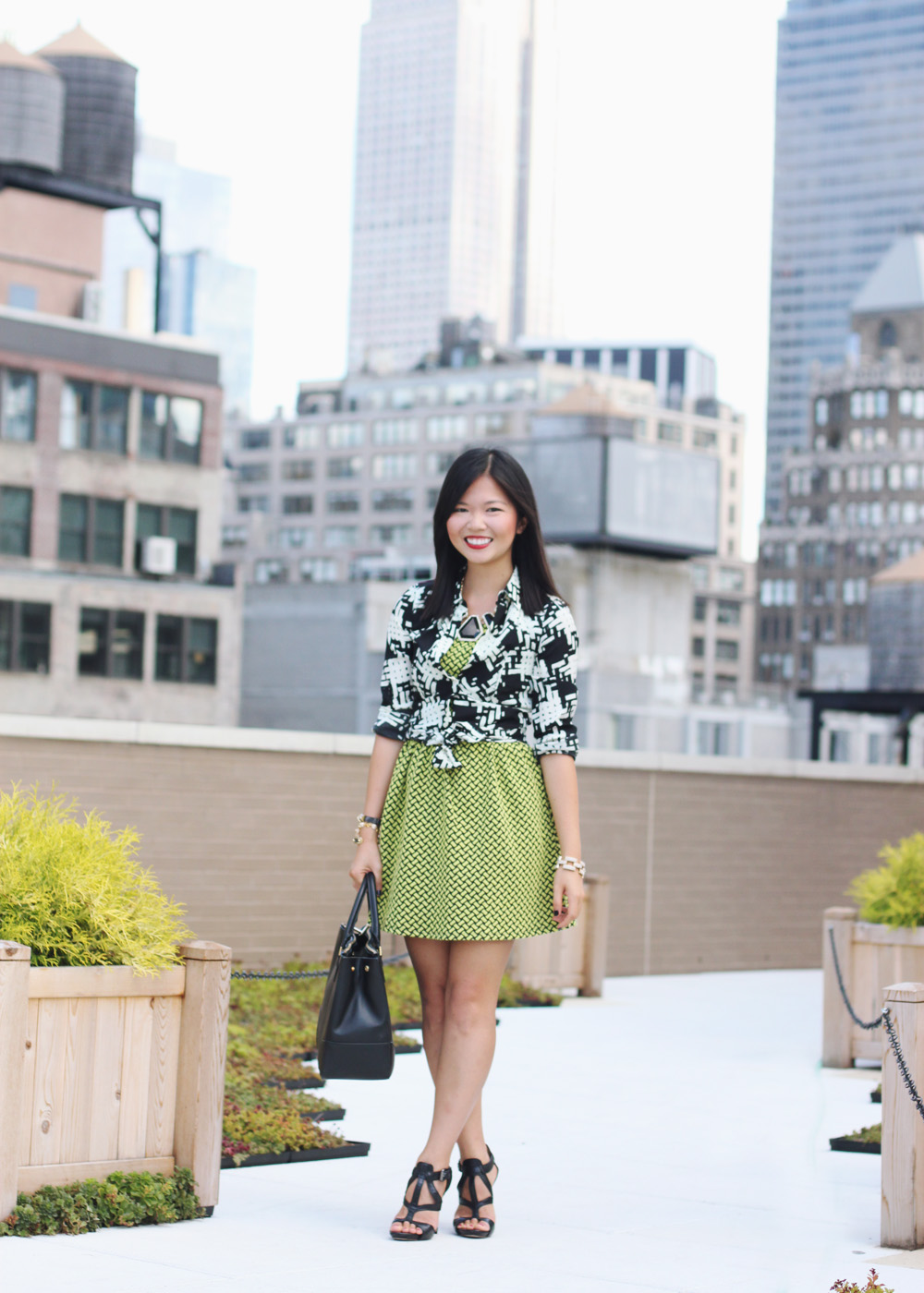 Skirt The Rules Blog; NYC fashion blogger; style blog; fall outfit photo; how to mix prints for fall; Rachel by Rachel Roy graphic print blouse; Forever 21 neon black textured dress; Tory Burch Robinson satchel tote; Juicy Couture pave pyramid leather bracelet; C. Wonder snakeskin skinny bangle cuff; CC Skye Mercy Princess bracelet; J.Crew pave square link bracelet; L.A.M.B black strappy heels