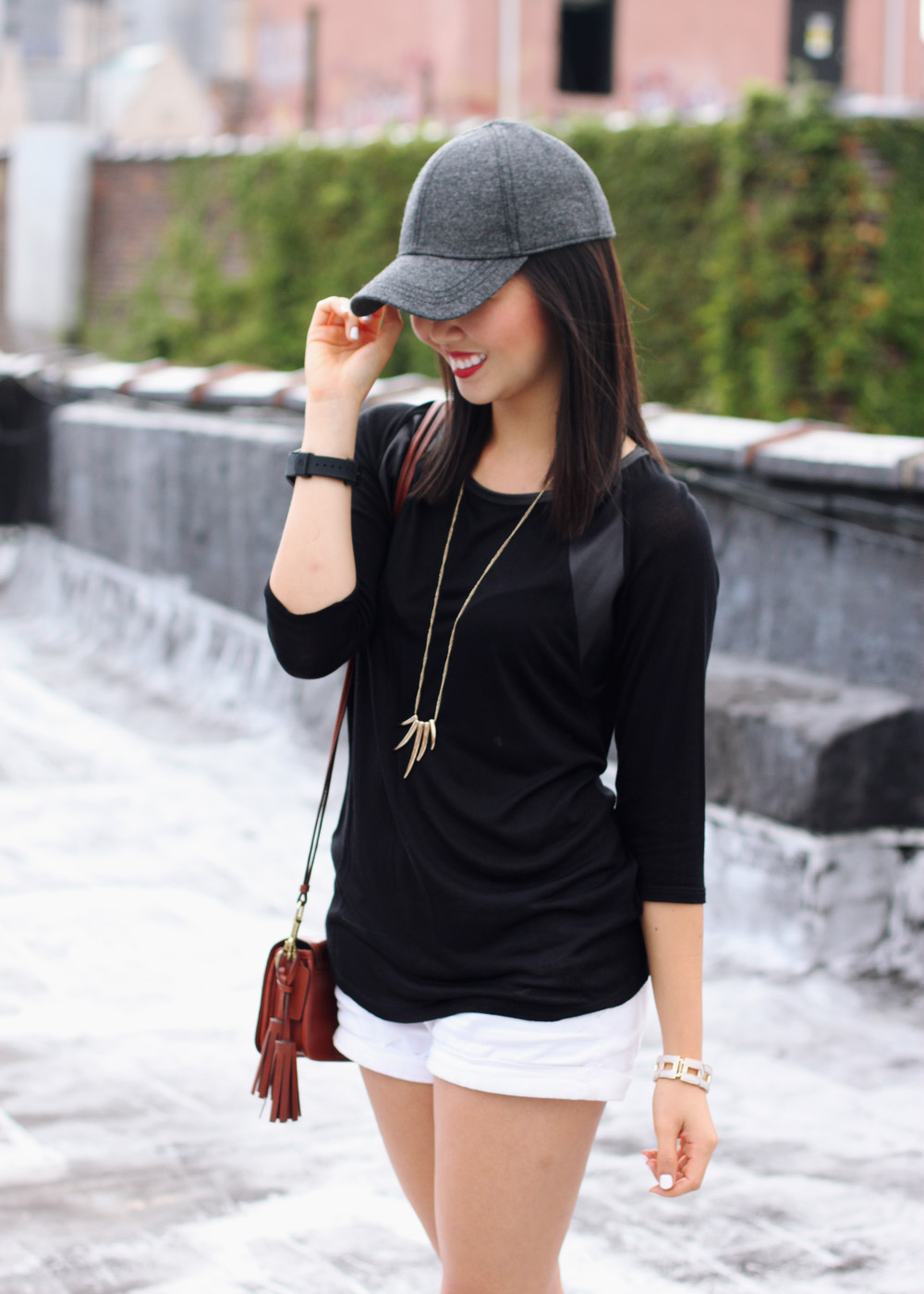 Skirt The Rules Blog; NYC fashion blogger; style blog; fall outfit photo; how to wear a baseball cap; Zara black leather panel top; Hollister white shorts; Sequin gold talon necklace;  Coach Legacy brown crossbody bag; Movado Esq One black silicone unisex watch; Joie Dylan leopard loafers; Essie white nail polish