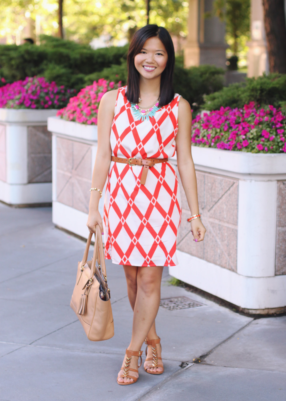 Skirt The Rules Blog; NYC fashion blogger; style blog; summer outfit photos; Le Tote Orange Graphic Dress; Courtney Kerr x BaubleBar Neon Alaqua tribal statement necklace; J.Crew brown belt; Coach Candace carryall tote in camel; CC SKYE Mercy Princess gold pave cone bracelet; Dolce Vita Helia gold chevron sandal wedges