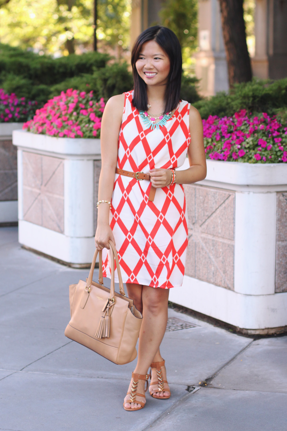 Skirt The Rules Blog; NYC fashion blogger; style blog; summer outfit photos; Le Tote Orange Graphic Dress; Courtney Kerr x BaubleBar Neon Alaqua tribal statement necklace; J.Crew brown belt; Coach Candace carryall tote in camel; CC SKYE Mercy Princess gold pave cone bracelet; Dolce Vita Helia gold chevron sandal wedges