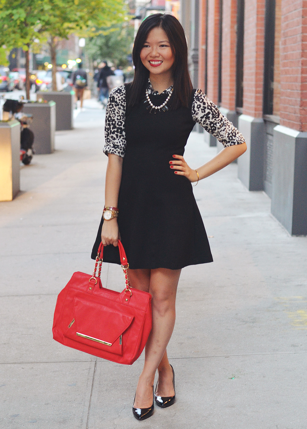 Skirt The Rules Blog; NYC fashion blogger; how to style a little black dress; how to wear a shirt under a dress; Zara black a-line skater skirt; J.Crew black and white snow leopard button up shirt; T&J Designs black statement necklace; Lipstick Rose Red Riding oxblood bangle bracelet; Michael Kors gold mother of pearl face boyfriend watch; Pour La Victoire Mai black patent wedge pumps; Olivia & Joy Rockefeller red satchel