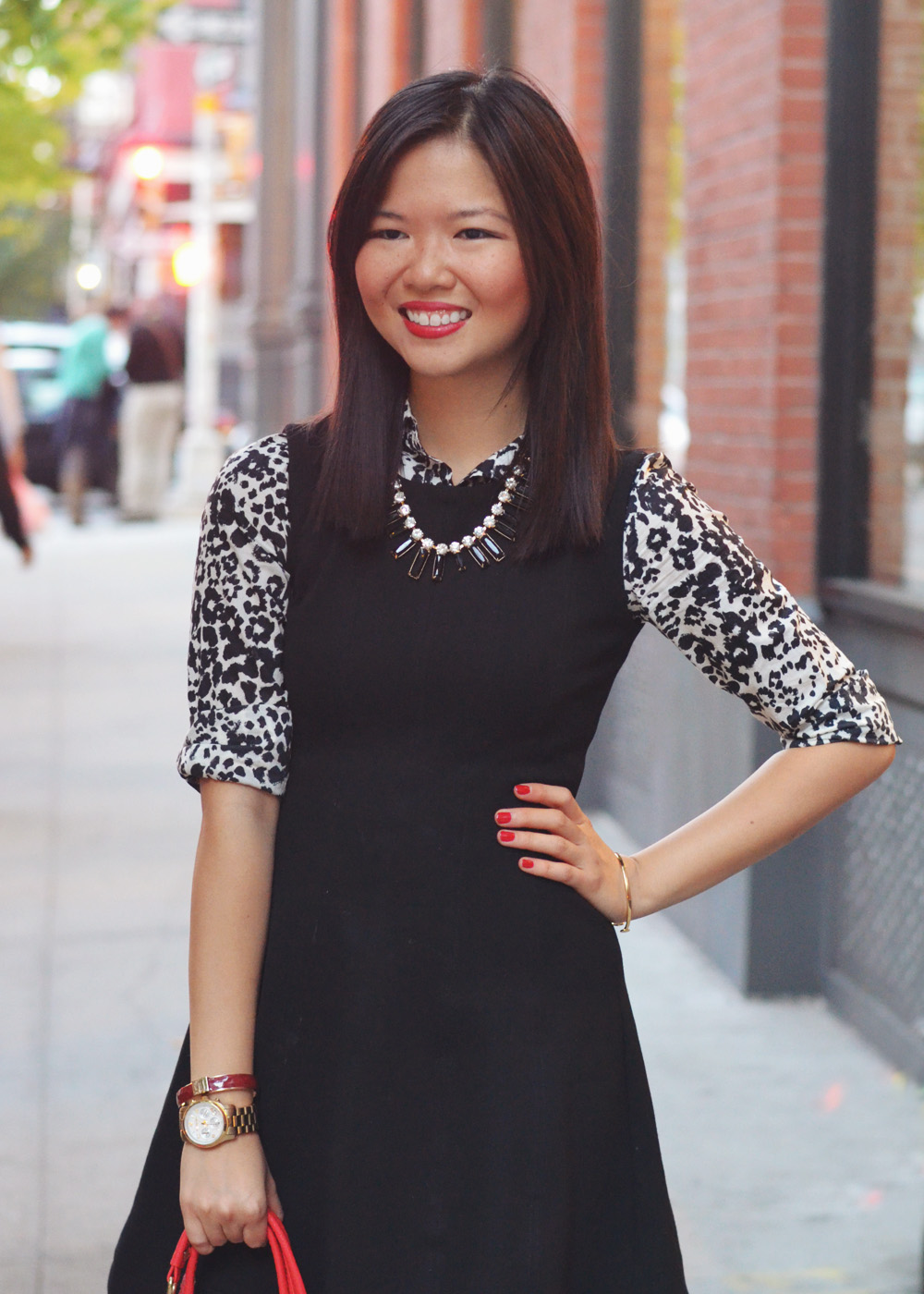 Skirt The Rules Blog; NYC fashion blogger; how to style a little black dress; how to wear a shirt under a dress; Zara black a-line skater skirt; J.Crew black and white snow leopard button up shirt; T&J Designs black statement necklace; Lipstick Rose Red Riding oxblood bangle bracelet; Michael Kors gold mother of pearl face boyfriend watch; Pour La Victoire Mai black patent wedge pumps; Olivia & Joy Rockefeller red satchel