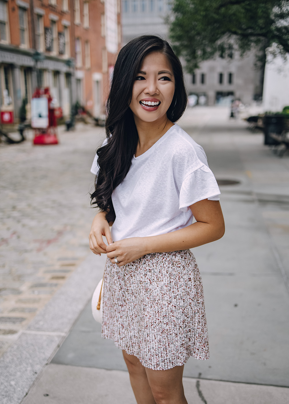 Casual Summer Outfit Ideas for Women: White Ruffle T-Shirt and Floral Shorts